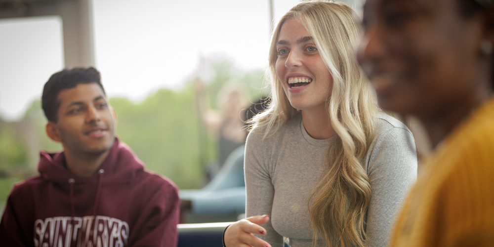 Students sit together talking