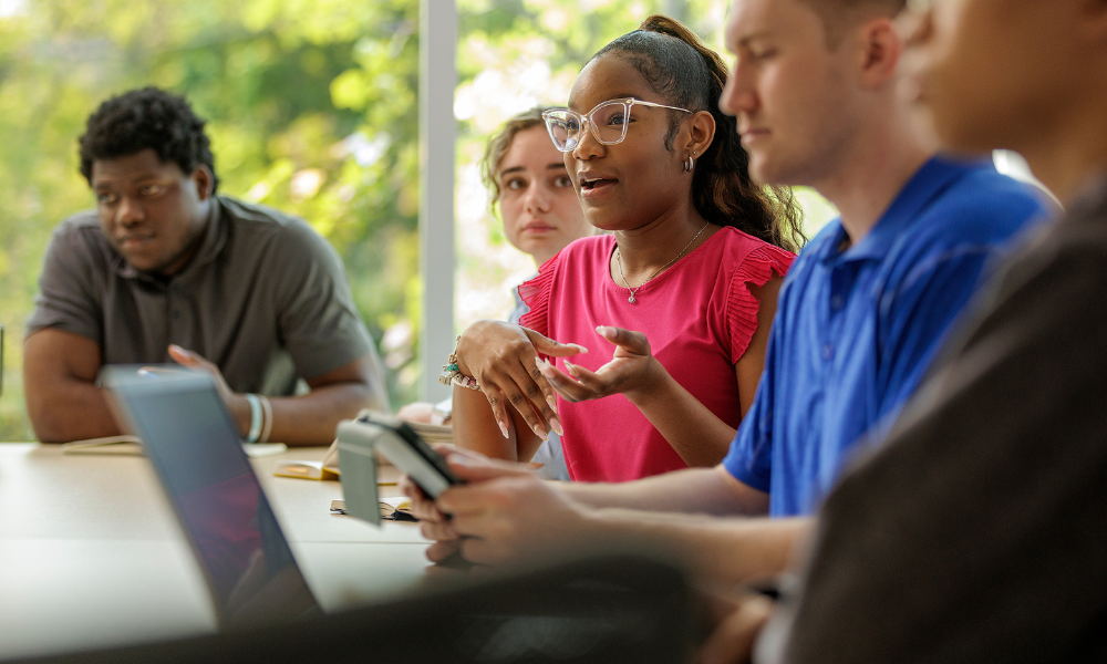Students engage in conversation in a classroom
